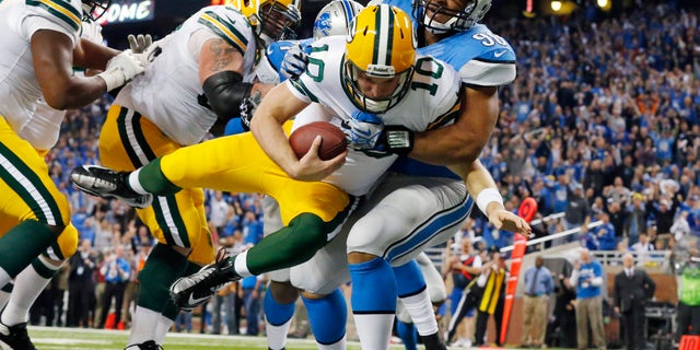 Detroit Lions defensive tackle Ndamukong Suh (90) sacks Green Bay Packers quarterback Matt Flynn for a safety during the third quarter of an NFL football game at Ford Field in Detroit, Thursday, Nov. 28, 2013. (AP Photo/Paul Sancya)