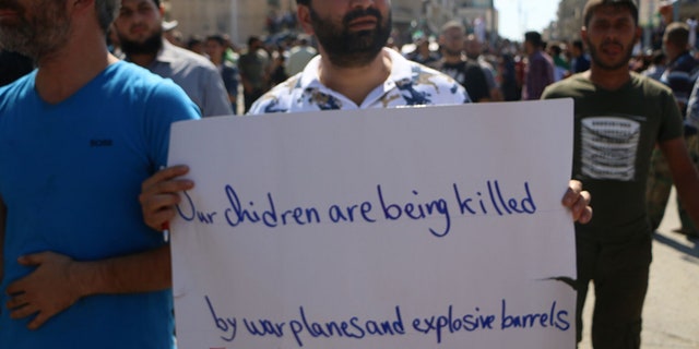 Activists in Idlib took to the streets Friday, protesting the forthcoming Assad and Russia offensive on their city