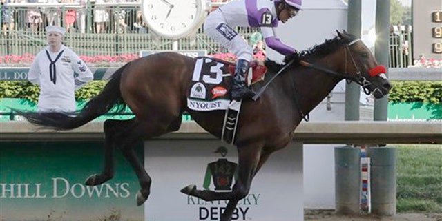 Mario Guitierrez rides Nyquist to victory during the 142nd running of the Kentucky Derby horse race at Churchill Downs Saturday, May 7, 2016, in Louisville, Ky. (AP Photo/Morry Gash)