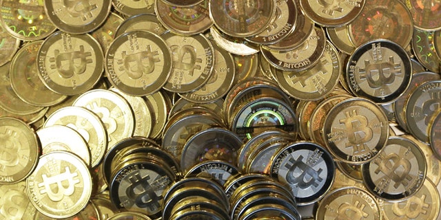 April 3, 2013: Bitcoin tokens at 35-year-old software engineer Mike Caldwell's shop in Sandy, Utah. Caldwell mints physical versions of bitcoins, cranking out homemade tokens with codes protected by tamper-proof holographic seals.