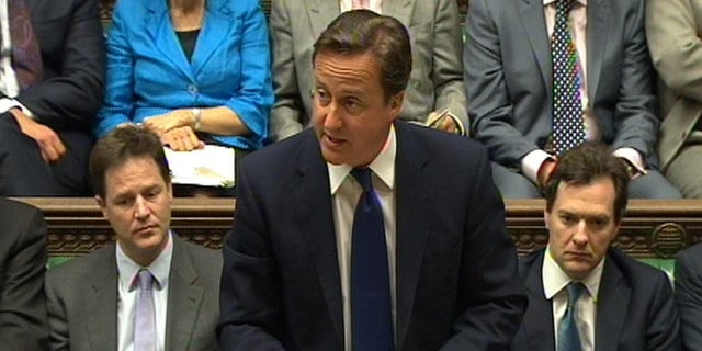 June 8: In this video image British Prime Minister David Cameron speaks during Prime Minister's Questions in the House of Commons, London, flanked by Deputy Prime Minister Nick Clegg, left, and Treasury chief George Osborne. Cameron says Britain and France will put forward a resolution at the United Nations condemning the crackdown in Syria. Cameron told the House of Commons that the two nations wish to condemn the repression by Bashar Assad's government. (AP/PA Wire)