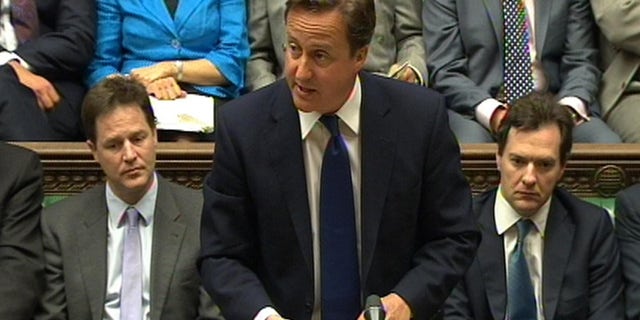 June 8: In this video image British Prime Minister David Cameron speaks during Prime Minister's Questions in the House of Commons, London, flanked by Deputy Prime Minister Nick Clegg, left, and Treasury chief George Osborne. Cameron says Britain and France will put forward a resolution at the United Nations condemning the crackdown in Syria. Cameron told the House of Commons that the two nations wish to condemn the repression by Bashar Assad's government. (AP/PA Wire)
