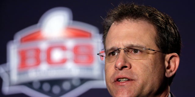 Auburn head coach Gus Malzahn answers a question during a news conference for the NCAA BCS National Championship college football game Sunday, Jan. 5, 2014, in Newport Beach, Calif. Florida State plays Auburn on Monday, Jan. 6, 2014. (AP Photo/David J. Phillip)