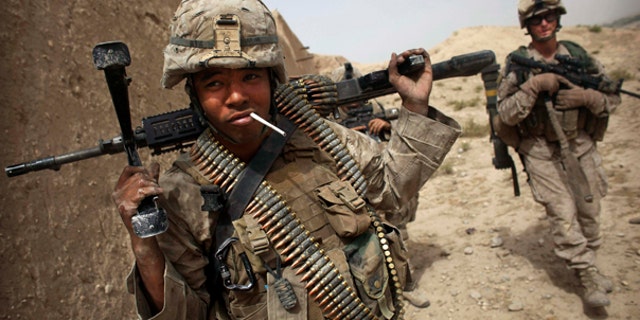 July 23: A U.S. Marine has a cigarette following a gun battle attempting to clear the area of insurgents in Helmand Province in southern Afghanistan.