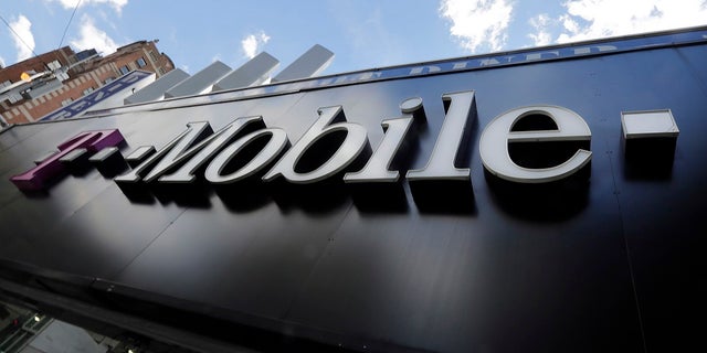 A T-Mobile store is shown in New York in this file photo. T-Mobile is being sued by a woman after a caretaker looking after her son was on hold while attempting to get in contact with 911.