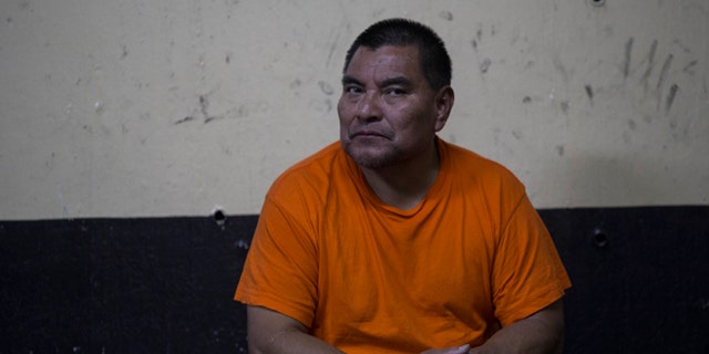 Santos Lopez Alonzo sits in a courtroom as he waits for his first hearing in Guatemala City, Wednesday, Aug. 10, 2016. Lopez Alonzo, former Guatemalan soldier suspected of helping carry out a massacre of more than 160 people in 1982 during the country's civil war was deported from the United States on Wednesday after a court refused his plea to stay because he fears for his life. (AP Photo/Luis Soto)