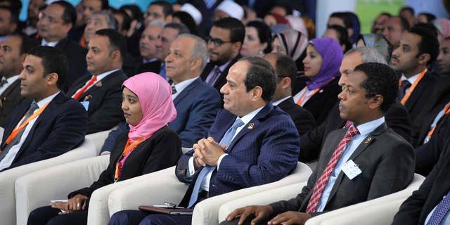 In this handout photo provided by the Egyptian presidency, President Abdel-Fattah el-Sissi, addresses a youth meeting in the southern city of Aswan on Saturday, Jan. 28, 2017. Egypt’s president has returned to some of his favorite topics, angrily denouncing the “evil people” plotting against his country and questioning the ideology of Islamic militants waging an insurgency against his government. (Egyptian presidency via AP)