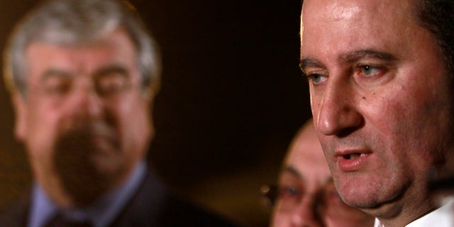 Left-wing party Stavros Malas, speaks to the media before the start of live televised debate between candidates Right-wing opposition leader Nicosia Anastasiades and Malas in Nicosia, Cyprus, Friday, Feb. 22, 2013. The conservative candidate Nicos Anastasiades in Cyprus’ election runoff Sunday, Feb. 24, looks poised to become the crisis-hit country’s new president charged with swiftly negotiating a rescue package with international creditors, analysts said Wednesday, even without a key endorsement from his third-place rival. (AP Photo/Petros Karadjias)