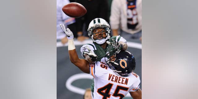 FILE - In a Sept. 22, 2014, file photo, New York Jets wide receiver Jeremy Kerley goes up for a pass into the end zone against Chicago Bears strong safety Brock Vereen (45) during the fourth quarter of an NFL football game in East Rutherford, N.J. The New York Jets announced Tuesday Oct. 21, 2014, they have signed Kerley to a four-year contract extension. (AP Photo/Bill Kostroun, file)