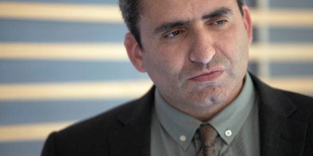 In this Sunday, May 26, 2013 photo, Israeli Deputy Foreign Minister Zeev Elkin listens during an interview with the Associated Press in Jerusalem. Elkin makes no apologies for his ideology or background, and says the world better get used to Jewish settlers holding positions of influence in Israel. (AP Photo/Dan Balilty)