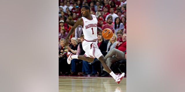 FILE - In this Dec. 4, 2012, fil ephoto, Arkansas' Mardracus Wade moves the ball up court during the first half of an NCAA college basketball game against Oklahoma in Fayetteville, Ark. Arkansas coach Mike Anderson is looking for a third scoring option to compliment. He'd love nothing better than for that option to become Wade, last season's SEC leader in 3-point percentage who has fallen on hard shooting times so far this season heading into Wednesday night's game with Auburn(AP Photo/Gareth Patterson, File)