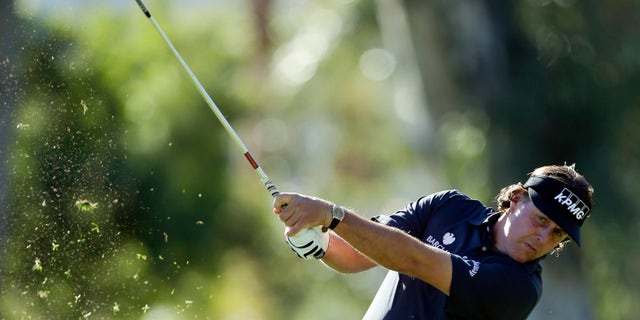Phil Mickelson hits from a fairway on the fifth hole during the first round of the Humana Challenge golf tournament at the La Quinta Country Club in La Quinta, Calif., Thursday, Jan. 17, 2013. (AP Photo/Chris Carlson)