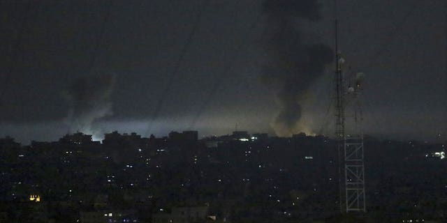 Smoke rises following an Israeli strikes on Gaza City, early Wednesday, May 30, 2018. Palestinian militants in the Gaza Strip fired at least 50 rockets and mortars into southern Israel on Tuesday, the largest barrage since the 2014 war between Israel and Hamas.