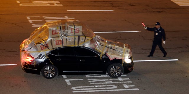 A South Korean vehicle fully loaded with goods and products brought back from North Korea's Kaesong industrial complex arrives at the customs, immigration and quarantine office near the border village of Panmunjom, that has separated the two Koreas since the Korean War, in Paju, north of Seoul, South Korea, Tuesday, April 30, 2013. North Korea on Monday approved the withdrawal of most of the remaining South Korean personnel at a jointly run industrial park in the North, South Korean officials said, with a final seven set to stay behind to negotiate unpaid wages for North Korean workers. (AP Photo/Lee Jin-man)