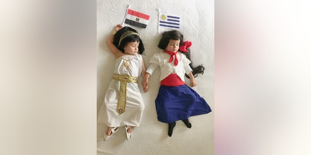 A mum has made her two-year-old twins homemade outfits to represent the opposing teams in every World Cup game.