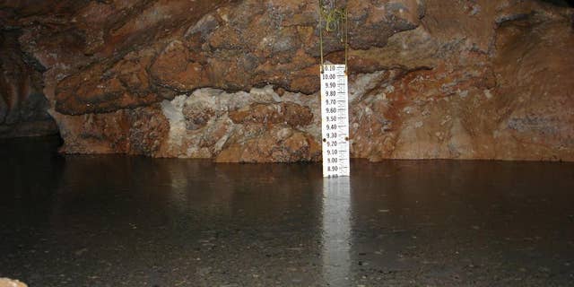 This 2006 photo provided by The National Park Service shows a gauge that measures the rise and fall of the Madison Aquifer water level at Calcite Lake in The Wind Cave National Park in the Black Hills of South Dakota. The underground lakes, which were discovered in the 1960s, aren't home to any animal life but prominent cave microbiologist Hazel Barton has discovered there is bacteria - albeit scant - in the lakes. Barton hopes to decipher how the bacteria survives and answer questions about how it interacted before multicellular organisms came along and perhaps find new sources of antibiotics. (The National Park Service via AP)