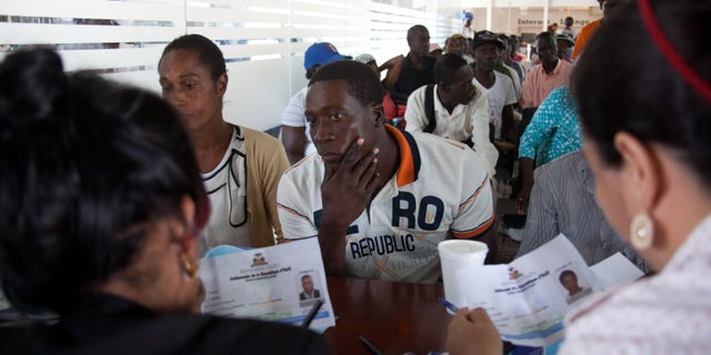 A Haitian man registers for legal residency at the Interior Ministry in Santo Domingo, Dominican Republic, Tuesday, June 16, 2015. Army Gen. Rubel Paulino says those who havenât registered by Thursday âwill be repatriated,â which conflicts with statements by Interior Minister Ramon Fadul that there will be no mass deportations. (AP Photo/Tatiana Fernandez)
