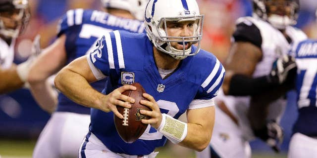 Indianapolis Colts quarterback Andrew Luck (12) runs during the first half of an NFL football game against the Jacksonville Jaguars, Sunday, Nov. 23, 2014, in Indianapolis. (AP Photo/Michael Conroy)