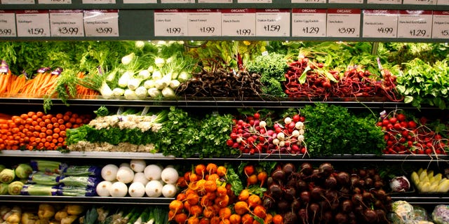 Organic vegetables are shown at a Whole Foods Market in LaJolla, California in this May 13, 2008 file photo. As recession tests the middle-class commitment to healthy eating and environmentally sound farming, sales of organic food are slowing, but so far not falling. How green are our wallets? To match feature FINANCIAL/FOOD-ORGANIC REUTERS/Mike Blake/Files (UNITED STATES) - RTR23YED
