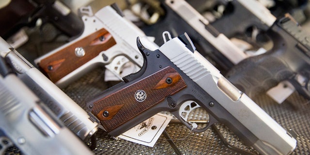TINLEY PARK, IL - MARCH 11: Handguns are offered for sale at Freddie Bear Sports on March 11, 2015 in Tinley Park, Illinois. According to a survey conducted by the University of Chicago 32 percent of Americans own guns, down from a high of 50 percent of the population in the 1970s and early 1980s. (Photo by Scott Olson/Getty Images)