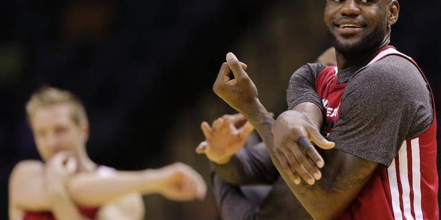 Miami Heat forward LeBron James warms up during basketball practice on Wednesday, June 4, 2014 in San Antonio. They play Game 1 of the NBA Finals against the San Antonio Spurs on Thursday. (AP Photo/Eric Gay)