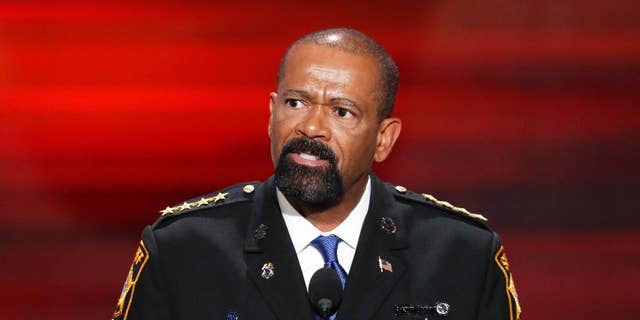 FILE- In this July 18, 2016, file photo, David Clarke, Sheriff of Milwaukee County, Wis., speaks during the opening day of the Republican National Convention in Cleveland. A jury on Monday, May 1, 2017, recommended criminal charges against seven Milwaukee County jail staffers in the dehydration death of an inmate who went without water for seven days. The jail is overseen by Clarke, but the inquest did not target him.  (AP Photo/J. Scott Applewhite, File)