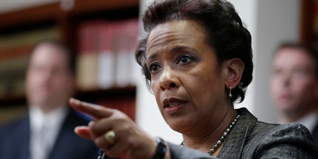 April 28, 2014: Loretta Lynch, U.S. Attorney for the Eastern District of New York, speaks during a news conference in New York. President Obama chose Loretta Lynch as attorney general on Nov. 7, 2014, which would make her the first black woman in the position. (AP/Seth Wenig, File)