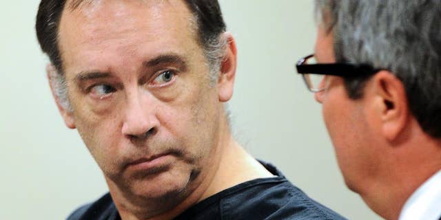 FILE - In this Aug. 5, 2014 file photo, Steven Zelich, left, appears in court in Kenosha, Wisc. Zelich, a former suburban Milwaukee police officer accused of killing two women and ditching their bodies in suitcases along a rural Wisconsin highway is facing extradition to Minnesota where he's charged in the death of one of the victims. The Wisconsin case against Zelich was expected to wrap up Wednesday, June 8, 2016, when he enters a plea and is sentenced on two counts of hiding a corpse in Walworth County. (Sean Krajacic /The Kenosha News via AP, File) MANDATORY CREDIT
