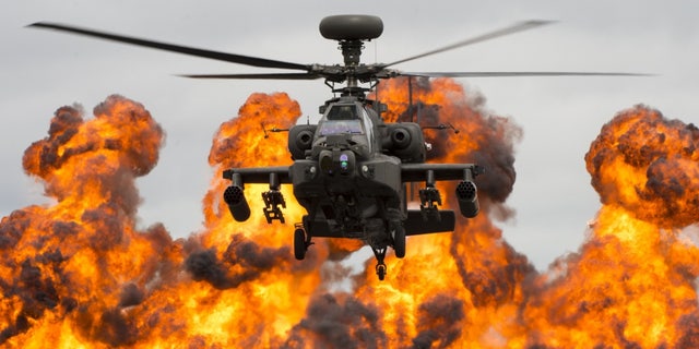 A Royal Air Force WAH-64D Apache helicopter demonstrates its combat capabilities for spectators during the 2017 Royal International Air Tattoo (RIAT) at RAF Fairford, England, in July 2017.