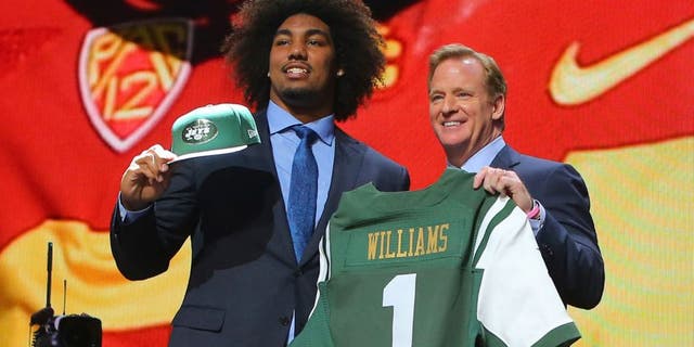 Apr 30, 2015; Chicago, IL, USA; Leonard Williams (Southern California) poses for a photo with NFL commissioner Roger Goodell after being selected as the number sixth overall pick to the New York Jets in the first round of the 2015 NFL Draft at the Auditorium Theatre of Roosevelt University. Mandatory Credit: Dennis Wierzbicki-USA TODAY Sports