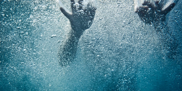 Underwater shot of a woman swimming