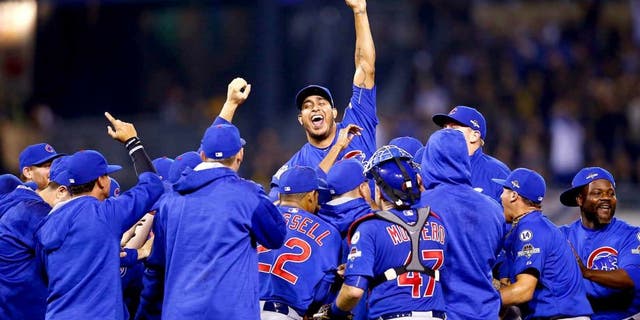 PITTSBURGH, PA - OCTOBER 07: The Chicago Cubs celebrate defeating the Pittsburgh Pirates to win the National League Wild Card game at PNC Park on October 7, 2015 in Pittsburgh, Pennsylvania. The Chicago Cubs defeated the Pittsburgh Pirates with a score of 4 to 0. (Photo by Jared Wickerham/Getty Images)