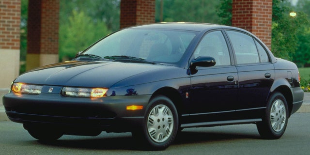 The boy stole a Saturn sedan like this one from a driveway when he found the keys inside of its cupholder.
