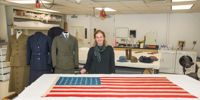 Curator Jennifer Jones with WWI Islay Flag in the Conservation Lab at the Nationl Museum of American History, Washington DC. See Centre Press story CPFLAG; A flag hand stitched on a Scottish island for a mass burial of American soldiers during World War I is making the 3,500-mile journey back to the island 100 years on. The stars and stripes were sewn in less than a day after the troopship SS Tuscania was struck by a German U-Boat around seven miles from Islay.