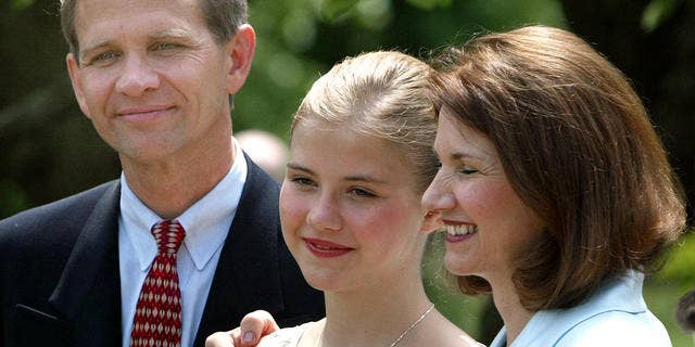 Elizabeth Smart appears with her parents, Lois and Edward Smart in 2003, after she was rescued.