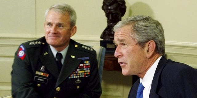Army General Dan McNeill meets with President George W. Bush in the Oval Office at the White House. General McNeill was U.S. Commander in Afghanistan from May 2002 until May 2003 and from February 2007 until June 2008. He was in charge of more than 10,000 troops in 2003 and 30,000 in 2008.