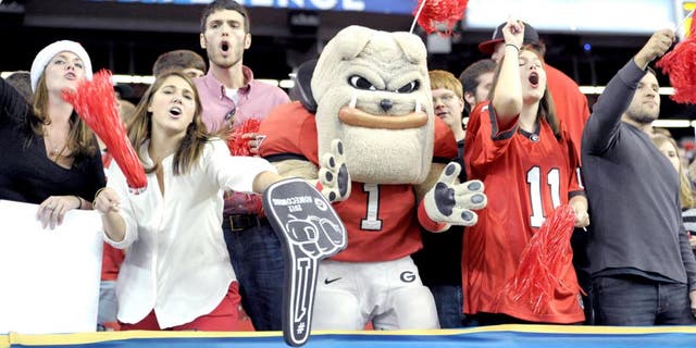 Dec 1, 2012; Atlanta, GA, USA; The Georgia Bulldogs mascot cheers with fans during the third quarter of the 2012 SEC Championship game against the Alabama Crimson Tide at the Georgia Dome. Mandatory Credit: Paul Abell-USA TODAY Sports