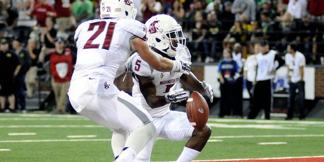 Sep 20, 2014; Pullman, WA, USA; Washington State Cougars wide receiver Rickey Galvin (5) and wide receiver River Cracraft (21) celebrate a touchdown against the Oregon Ducks during the first half at Martin Stadium. Mandatory Credit: James Snook-USA TODAY Sports