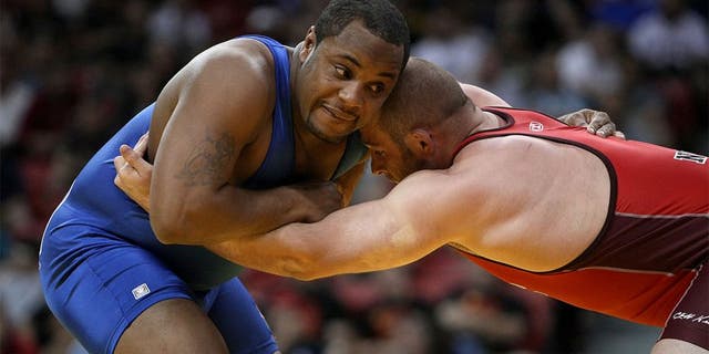 LAS VEGAS - JUNE 15: Daniel Cormier (blue) wrestles Damion Hahn (red) in the Freestyle 96kg division championship match during the USA Olympic trials for wrestling and judo on June 15, 2008 at the Thomas & Mack Center in Las Vegas, Neveda. (Photo by Jonathan Ferrey/Getty Images)