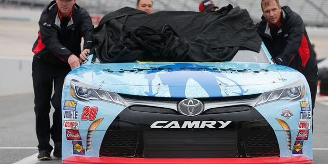 DOVER, DE - OCTOBER 01: Crew members push the #20 GameStop/Rise of the Tomb Raider: 20 Year Celebration Toyota, driven by Erik Jones (not pictured), during qualifying for the NASCAR XFINITY Series Drive Sober 200 at Dover International Speedway on October 1, 2016 in Dover, Delaware. (Photo by Brian Lawdermilk/Getty Images)