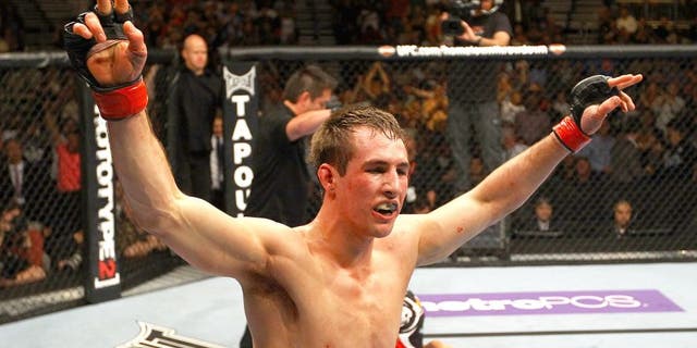 ATLANTA, GA - APRIL 21: Rory MacDonald celebrates as he defeats Che Mills by TKO during their welterweight bout for UFC 145 at Philips Arena on April 21, 2012 in Atlanta, Georgia. (Photo by Al Bello/Zuffa LLC/Zuffa LLC via Getty Images)