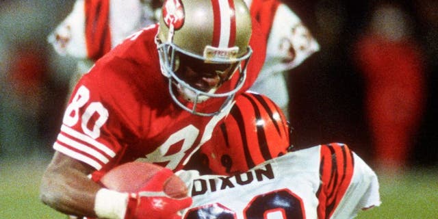 MIAMI, FL- JANUARY 22: Jerry Rice #80 of the San Francisco 49ers gets tackled by Rickey Dixon #29 of the Cincinnati Bengals during Super Bowl XXIII on January 22, 1989 at Joe Robbie Stadium in Miami, Florida. The 49ers won the Super Bowl 20-16. (Photo by Focus on Sport/Getty Images) *** Local Caption *** Jerry Rice; Rickey Dixon