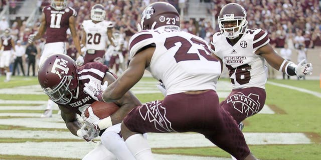 COLLEGE STATION, TX - OCTOBER 03: Ricky Seals-Jones #9 of the Texas A&amp;M Aggies catches a touchdown pass while being defended by Taveze Calhoun #23 of the Mississippi State Bulldogs in the first quarter on October 3, 2015 at Kyle Field in College Station, Texas. (Photo by Thomas B. Shea/Getty Images)
