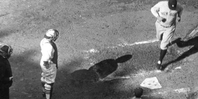 NEW YORK - October 6, 1926. Babe Ruth is crossing the plate after hitting his third home run on October 11, 1926 in the fourth game of the World Series in St. Louis. Bob O'Farrell is the Cardinals catcher. (Photo by Mark Rucker/Transcendental Graphics, Getty Images) *** Local Caption *** Babe Ruth;Bob O'Farrell