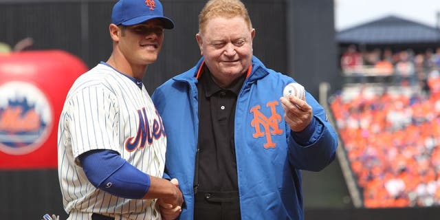NEW YORK, NY - APRIL 01: Former New York Mets player Rusty Staub throws out the first pitch to Catcher Anthony Recker #20 of the New York Mets before the game against the San Diego Padres on Opening Day at Citi Field on April 1, 2013 in New York City. Mets beat the Padres, 11-2. (Photo by Al Pereira/Getty Images)