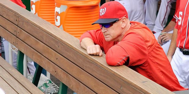 WASHINGTON, DC - SEPTEMBER 28: Manager Matt Williams #9 of the Washington Nationals looks out of the dugout before the game against the Cincinnati Reds at Nationals Park on September 28, 2015 in Washington, DC. (Photo by Greg Fiume/Getty Images)