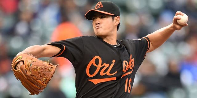 BALTIMORE, MD - OCTOBER 03: Wei-Yin Chen #16 of the Baltimore Orioles pitches in third inning during game one of a baseball game against the New York Yankees at Oriole Park at Camden Yards on October 3, 2015 in Baltimore, Maryland. (Photo by Mitchell Layton/Getty Images)
