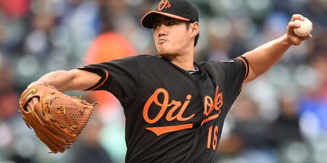 BALTIMORE, MD - OCTOBER 03: Wei-Yin Chen #16 of the Baltimore Orioles pitches in third inning during game one of a baseball game against the New York Yankees at Oriole Park at Camden Yards on October 3, 2015 in Baltimore, Maryland. (Photo by Mitchell Layton/Getty Images)