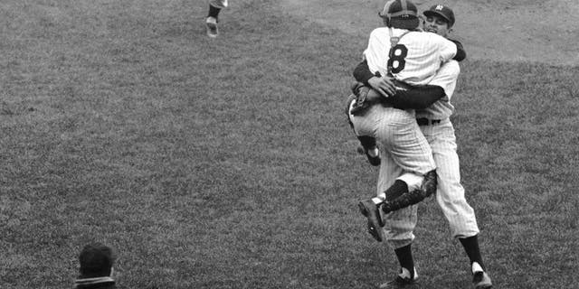 Don Larsen embraces Yogi Berra after the final out of Game 5 of the 1956 World Series. (Getty Images)