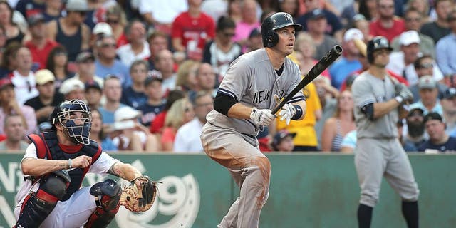 BOSTON, MA - SEPTEMBER 2: Stephen Drew #14 of the New York Yankees hits a three-run home run in the third inning against he Boston Red Sox at Fenway Park on September 2, 2015 in Boston, Massachusetts. (Photo by Jim Rogash/Getty Images)